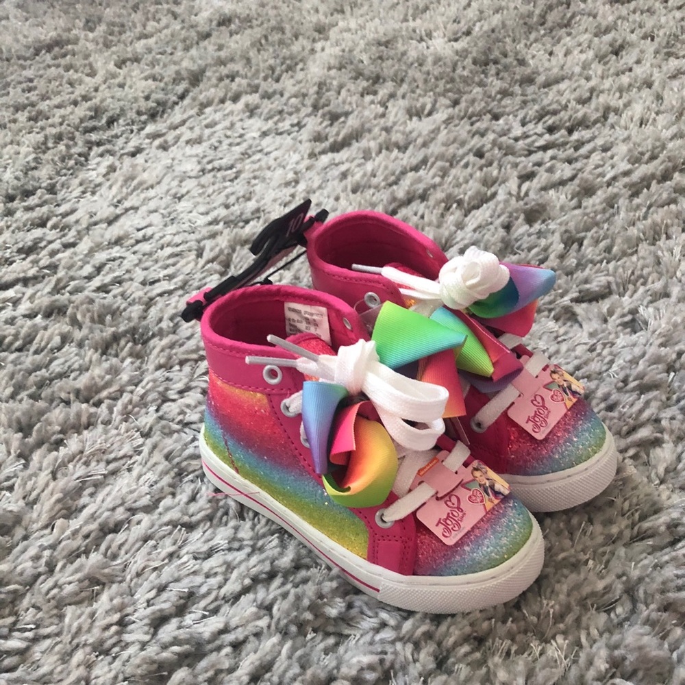 Jo Jo Siwa high top shoes.